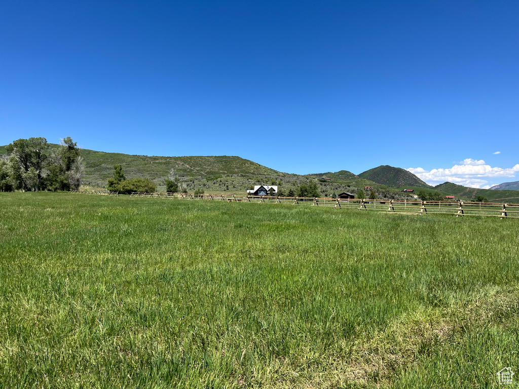 Property view of mountains featuring a rural view