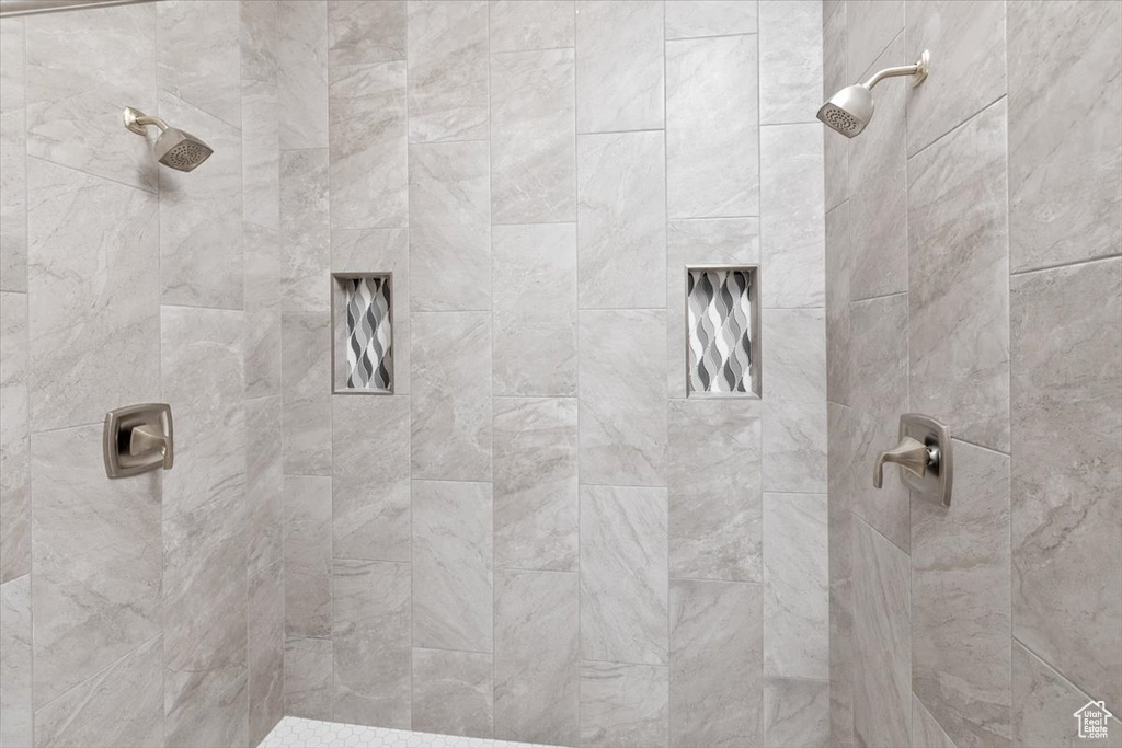 Full bathroom featuring tiled shower
