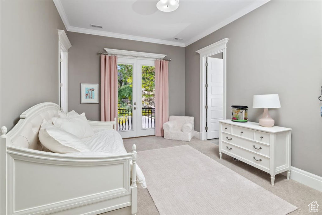 Bedroom featuring french doors, carpet, visible vents, crown molding, and access to outside