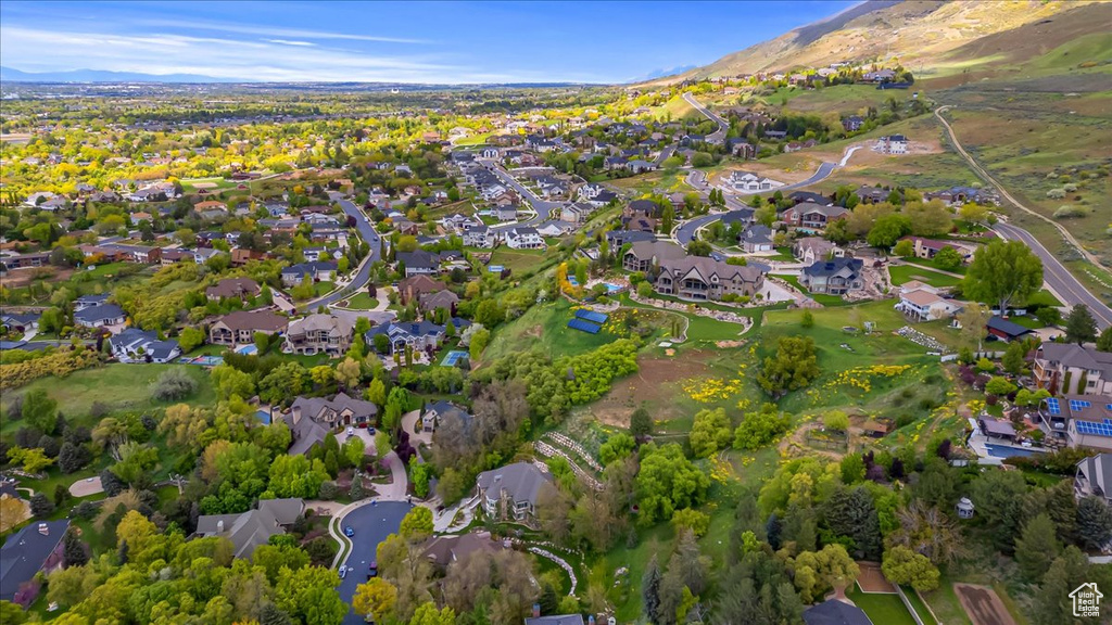 Drone / aerial view with a residential view and a mountain view