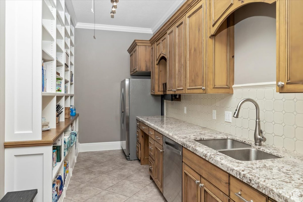 Kitchen featuring ornamental molding, a sink, open shelves, decorative backsplash, and appliances with stainless steel finishes