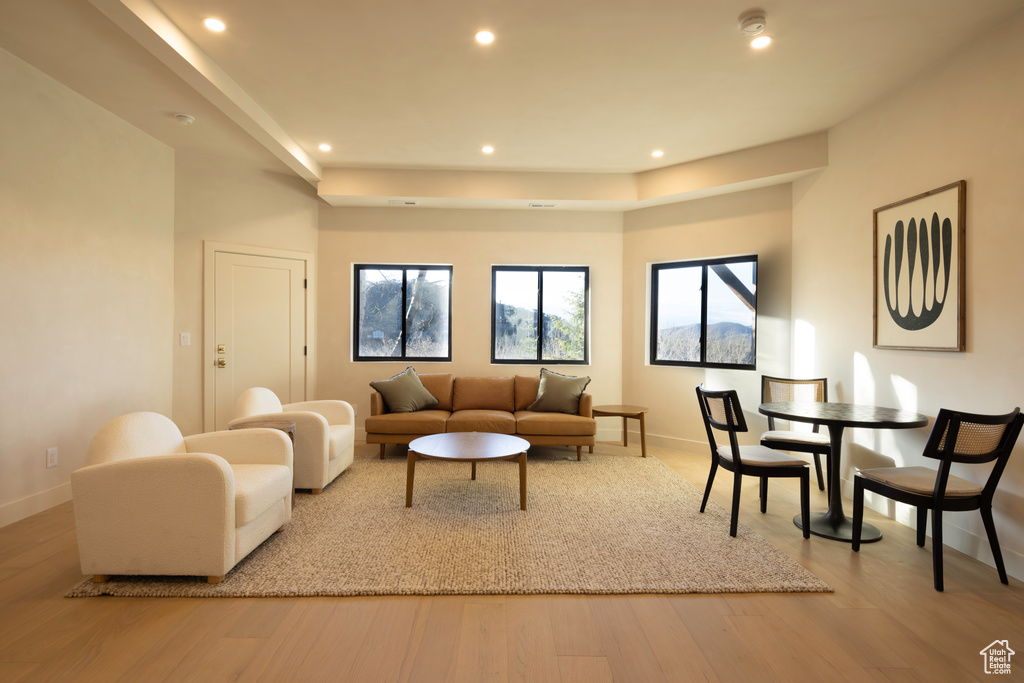 Living room featuring wood finished floors, baseboards, and recessed lighting