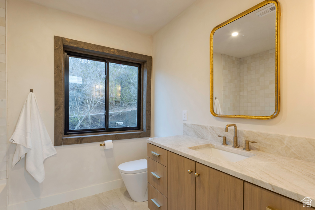 Bathroom featuring toilet and vanity