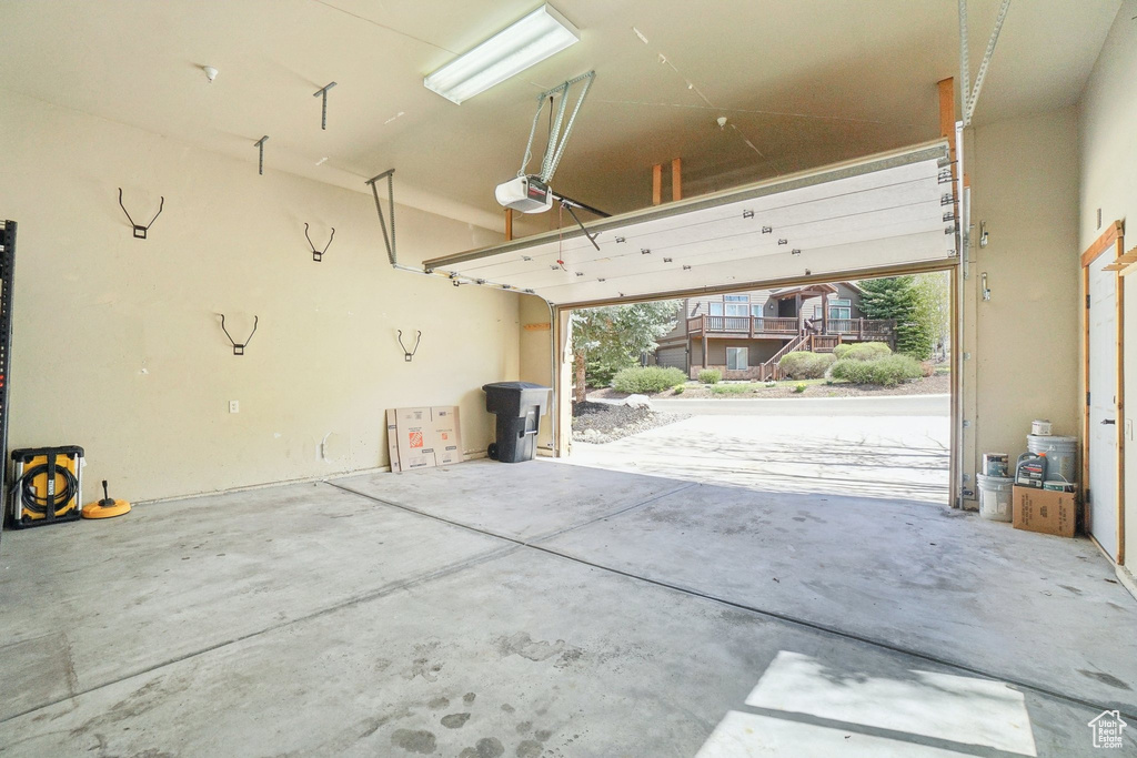 Garage featuring a garage door opener