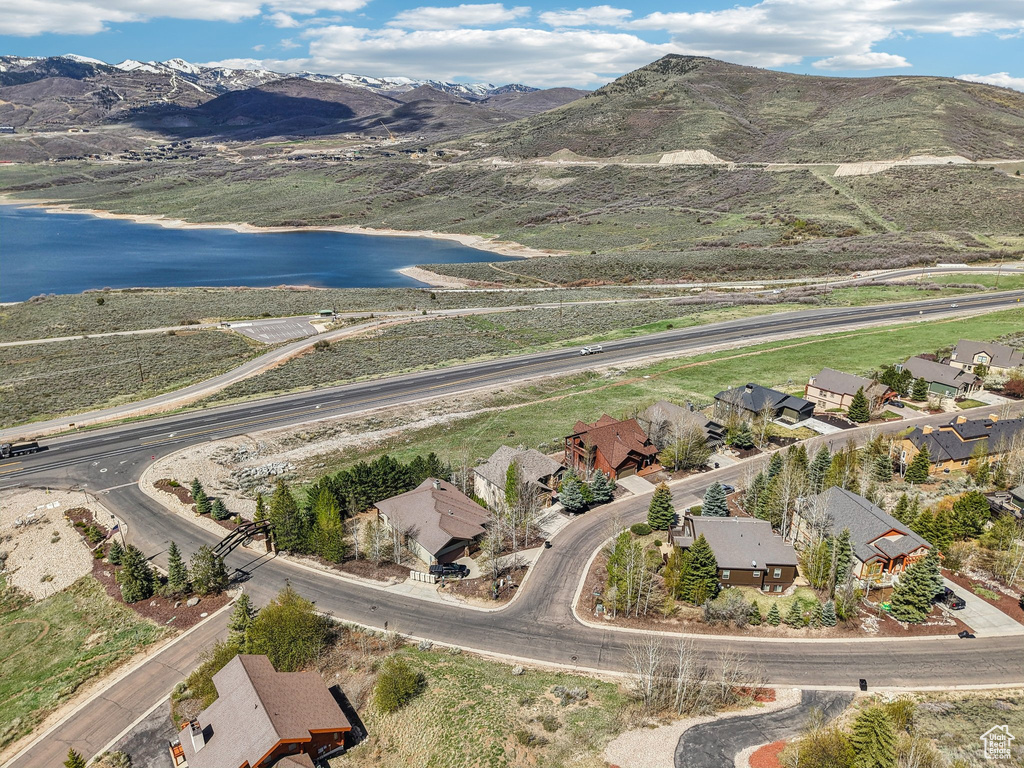 Birds eye view of property featuring a residential view and a water and mountain view