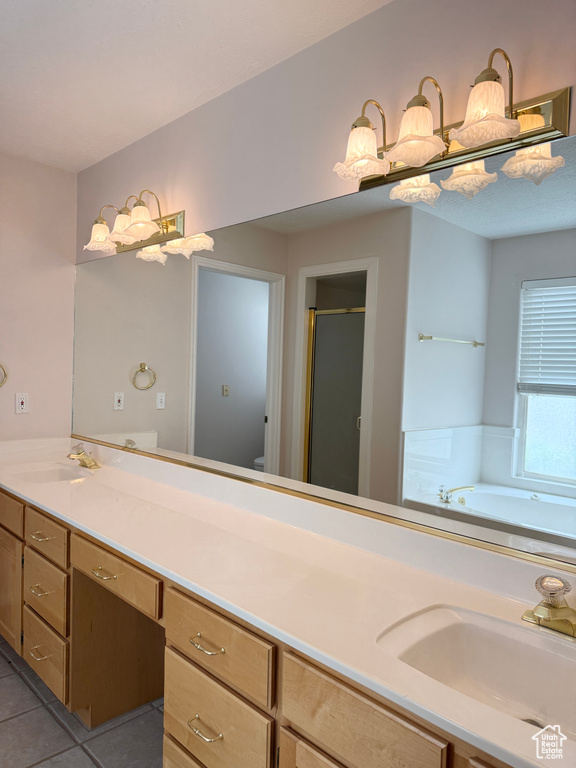 Full bath with vanity, a shower stall, tile patterned floors, and a bath