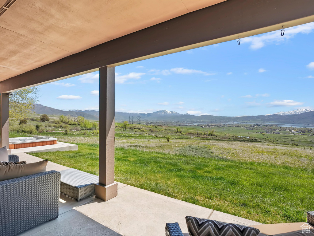 View of patio with a mountain view and a rural view