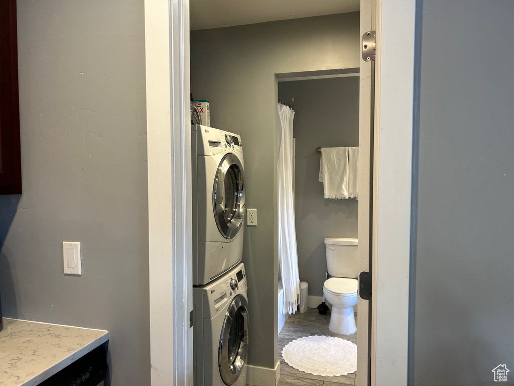 Laundry room with stacked washer / dryer and laundry area