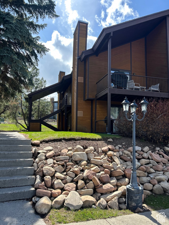 View of home's exterior featuring a chimney
