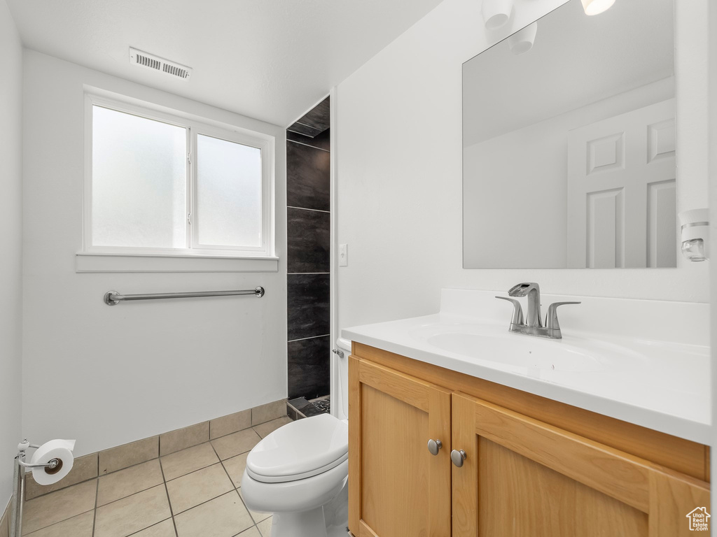 Full bath featuring visible vents, tile patterned floors, toilet, and vanity