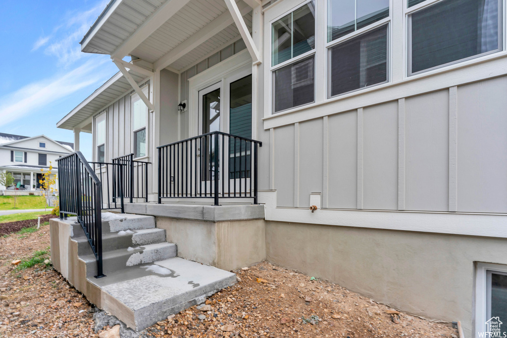 Entrance to property with board and batten siding