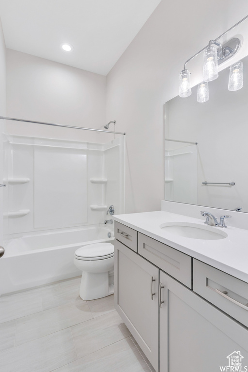 Bathroom with shower / bathing tub combination, toilet, vanity, recessed lighting, and tile patterned flooring