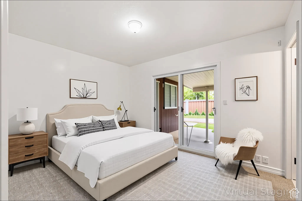 Bedroom with access to exterior and baseboards