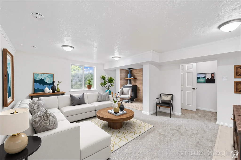 Living room featuring a wood stove and a textured ceiling