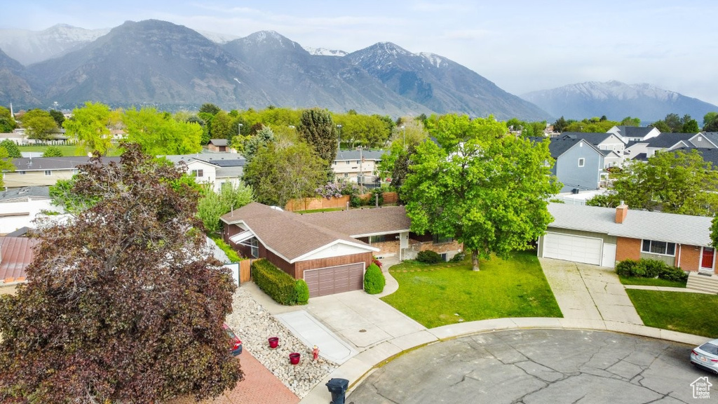 Birds eye view of property with a residential view and a mountain view