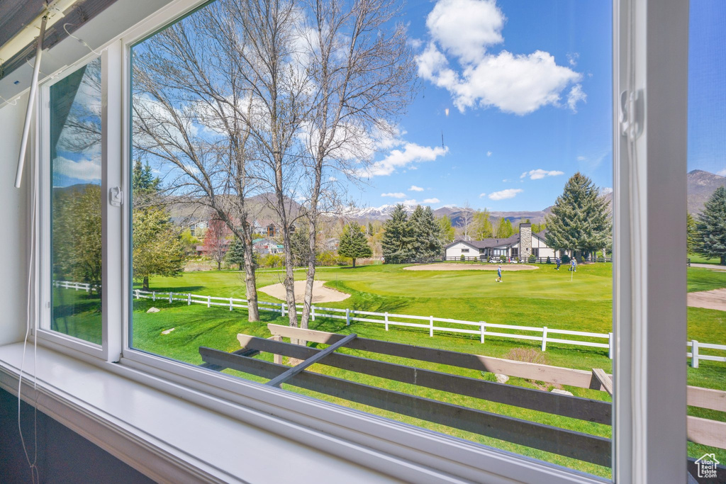 Interior space featuring fence and golf course view