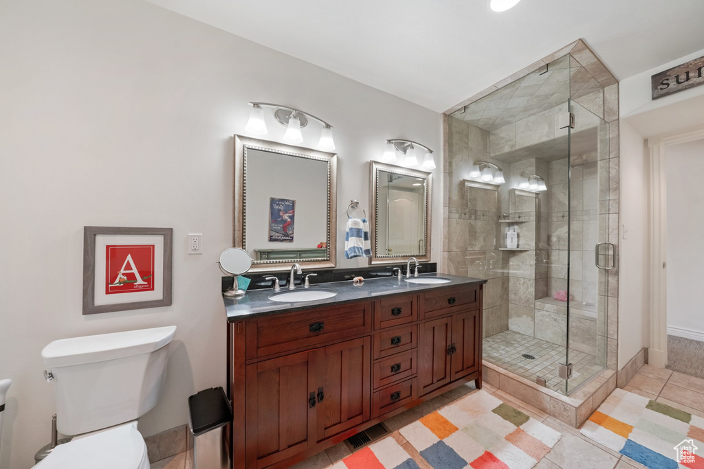 Full bathroom with tile patterned floors, a sink, and a stall shower