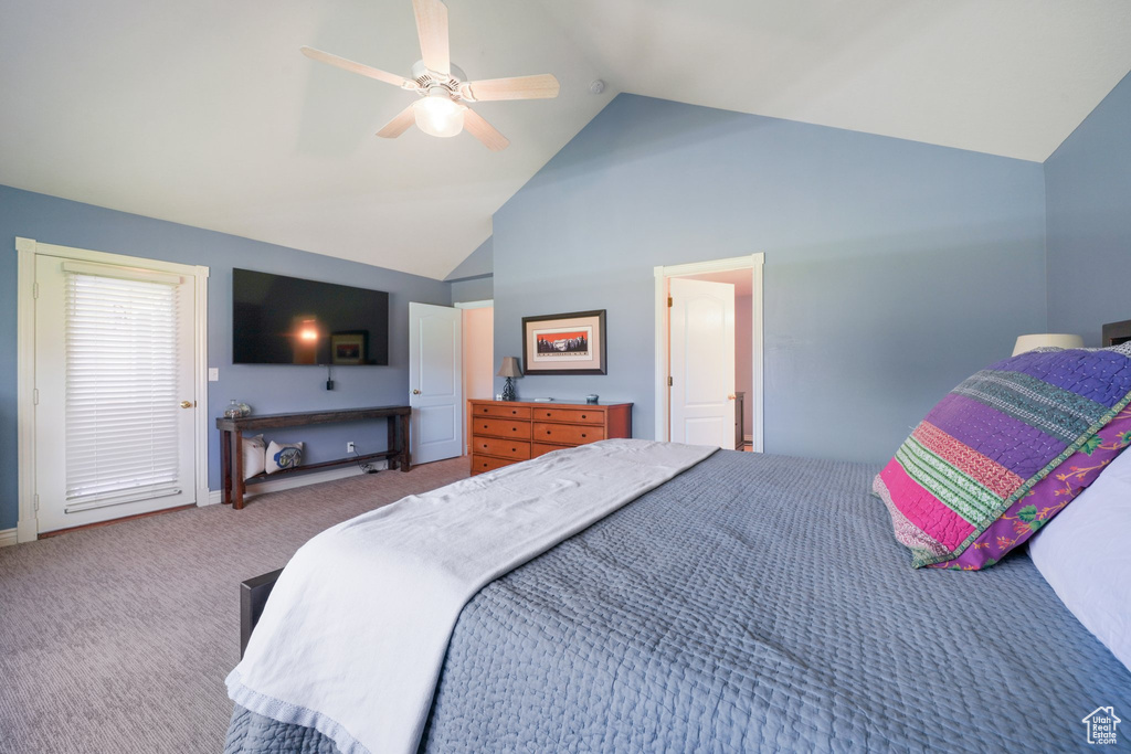 Carpeted bedroom featuring a ceiling fan and high vaulted ceiling