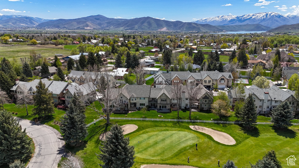 Aerial view with a residential view, a mountain view, and golf course view