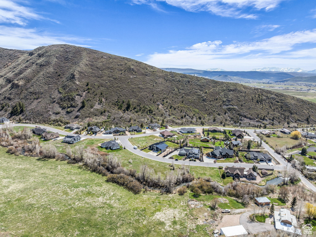 Aerial perspective of suburban area with a mountainous background