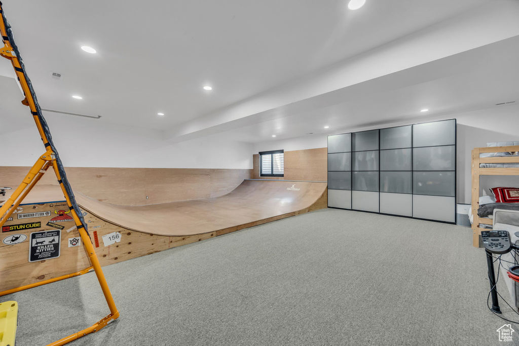 Game room with carpet and recessed lighting