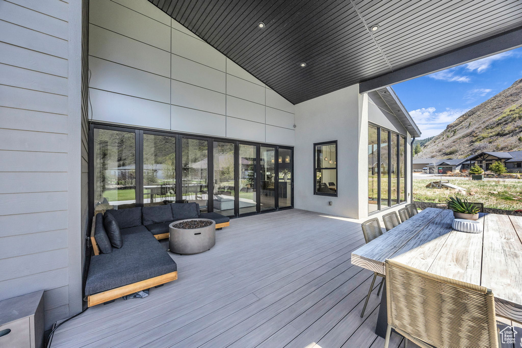 Wooden terrace featuring a mountain view