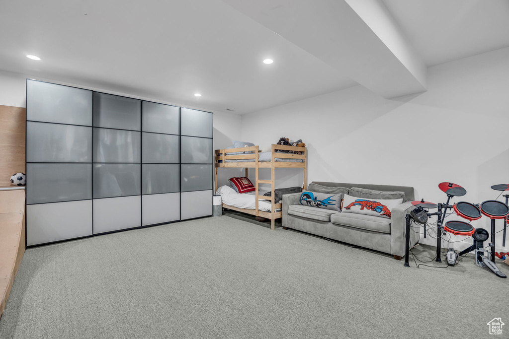 Sitting room featuring recessed lighting and carpet flooring