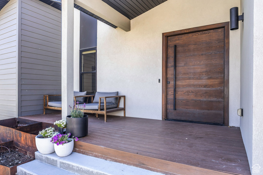 Doorway to property with stucco siding