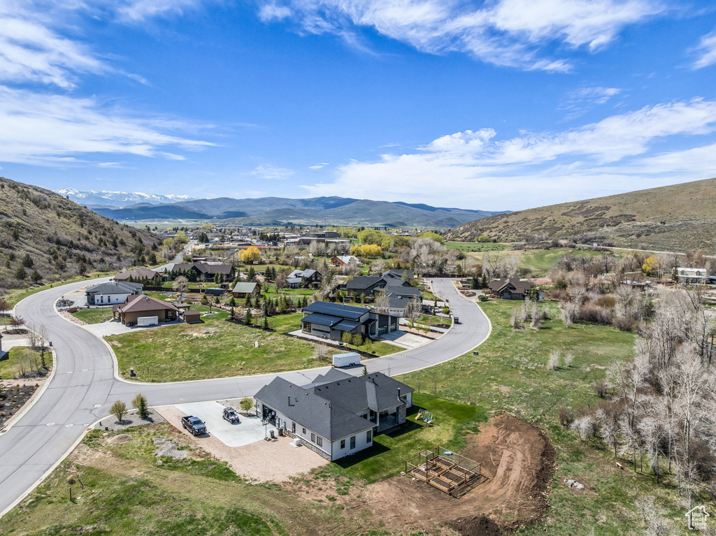 Aerial perspective of suburban area with a mountainous background