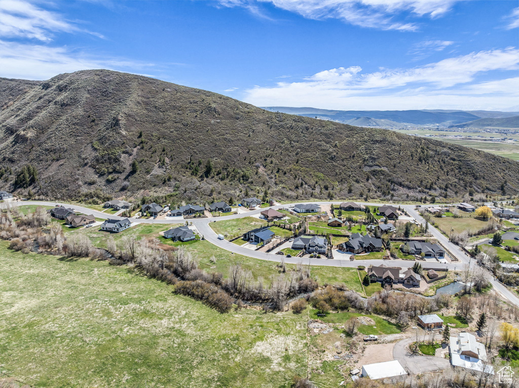 Aerial perspective of suburban area with a mountainous background
