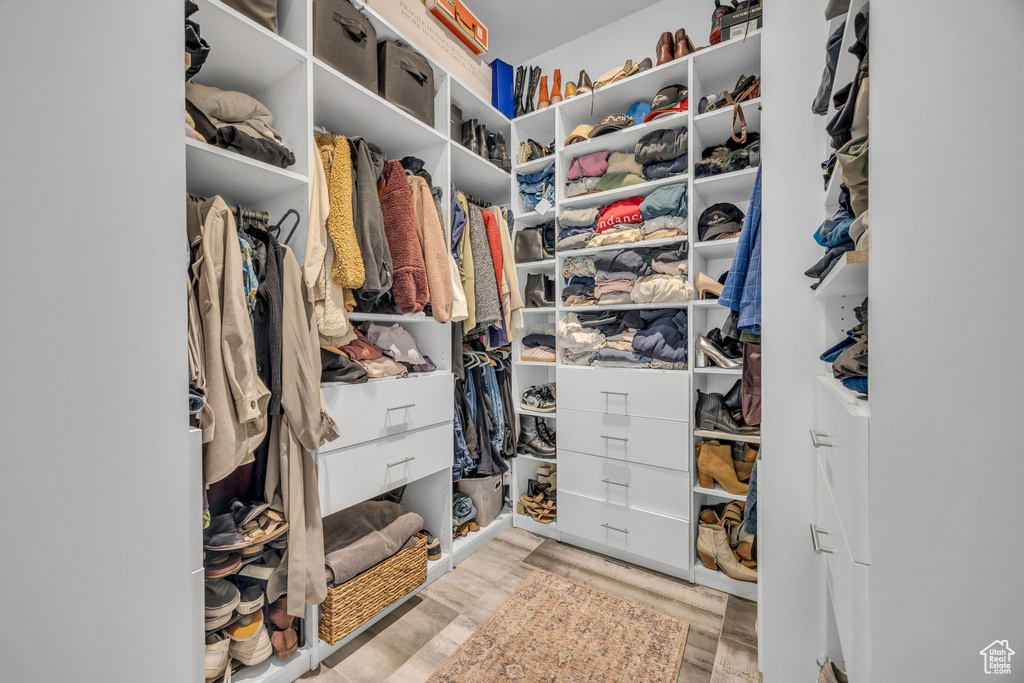 Spacious closet with wood finished floors