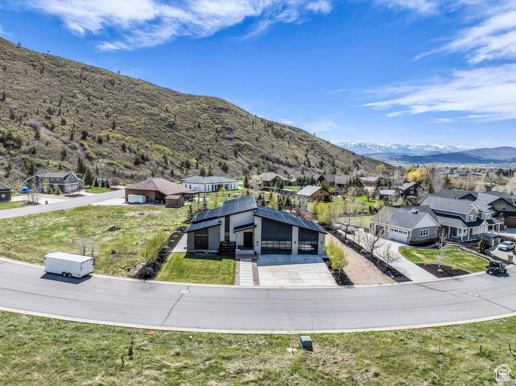 Aerial view of residential area featuring a mountain backdrop