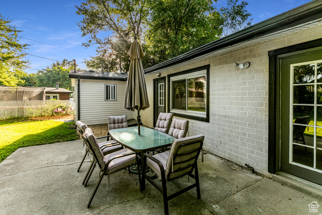 View of patio / terrace featuring outdoor dining area and fence