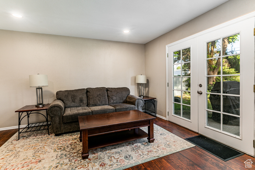 Living room featuring french doors, wood finished floors, baseboards, and recessed lighting