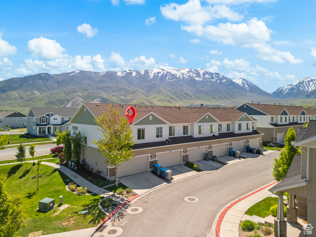 Property view of mountains with a residential view
