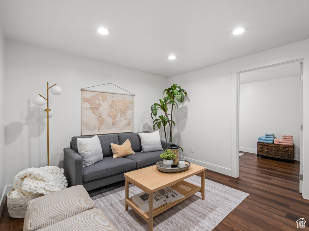 Living area featuring recessed lighting, baseboards, and wood finished floors