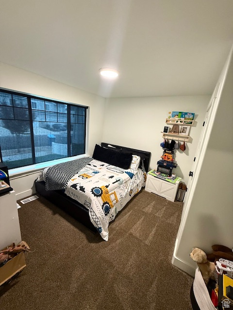 Bedroom featuring carpet flooring and visible vents