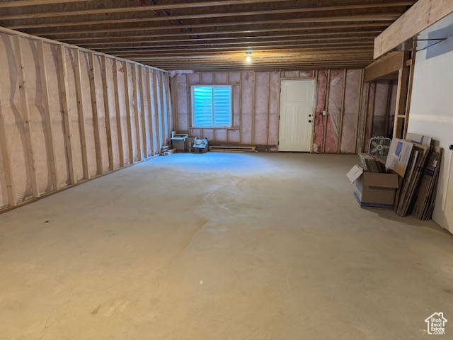 Basement with a baseboard heating unit