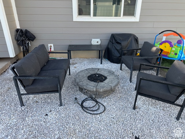 View of patio / terrace with a grill and an outdoor fire pit