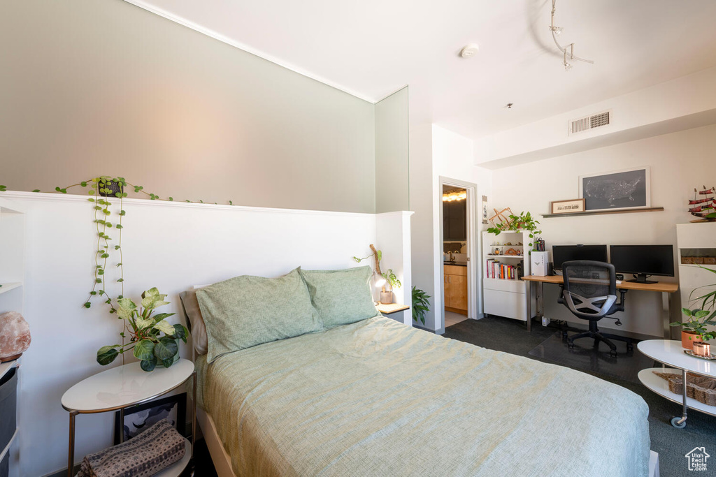 Carpeted bedroom with visible vents