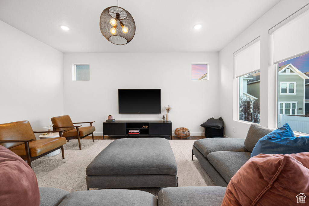 Living room featuring baseboards and recessed lighting