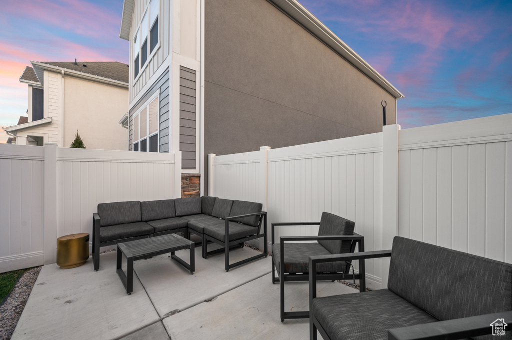 View of patio featuring outdoor lounge area and a fenced backyard