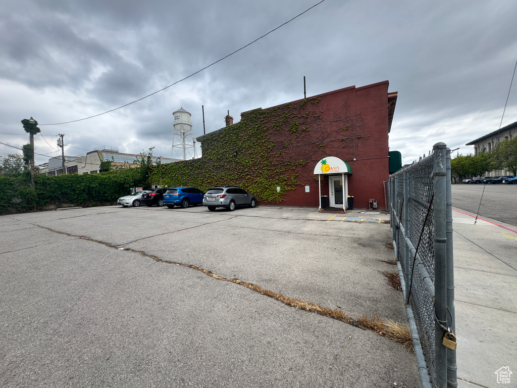 Uncovered parking lot with fence