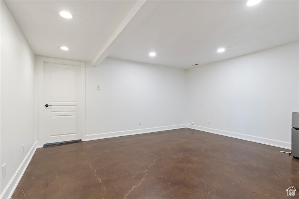 Finished basement with baseboards and recessed lighting