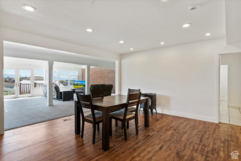 Dining space with recessed lighting, baseboards, and wood finished floors