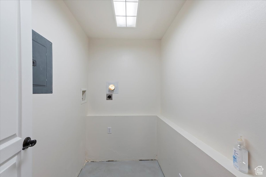 Laundry room featuring electric panel, laundry area, hookup for a washing machine, and electric dryer hookup