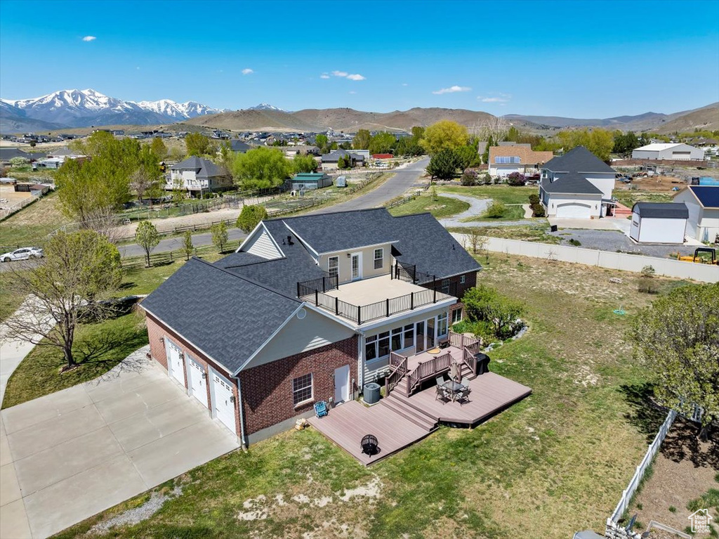 Drone / aerial view featuring a mountain view and a residential view