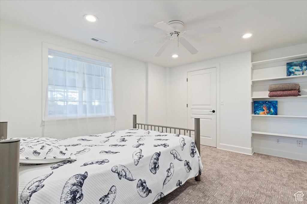 Bedroom with carpet flooring, a ceiling fan, visible vents, and recessed lighting