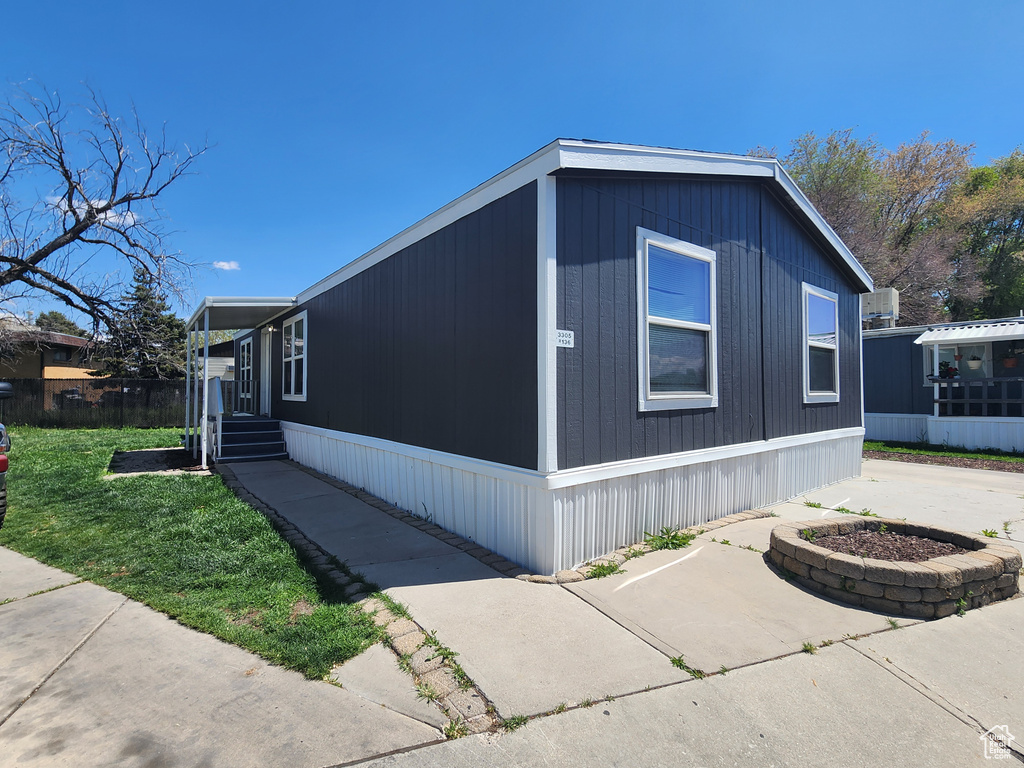 View of home\\\'s exterior with a lawn