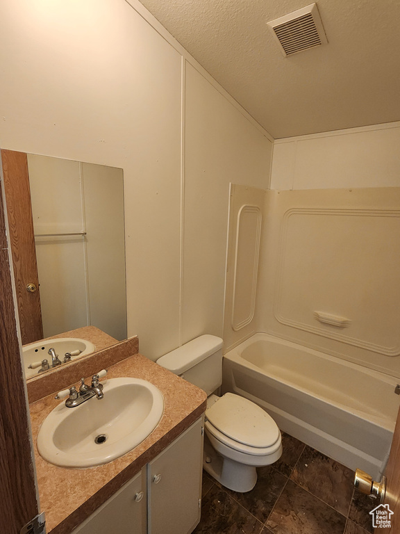Full bath with toilet, visible vents,  shower combination, and vanity